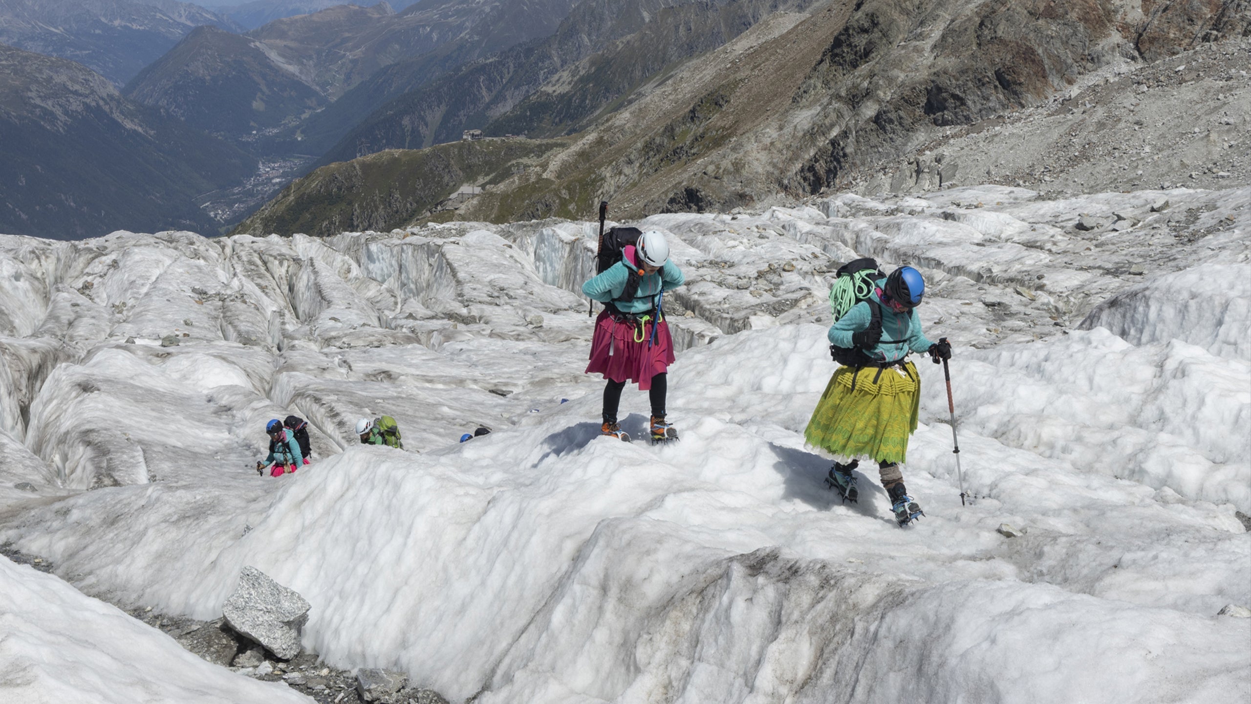 Cholitas, women's bolivian alpinist, wearing SCARPA's mountaineering boots on Mont Blanc