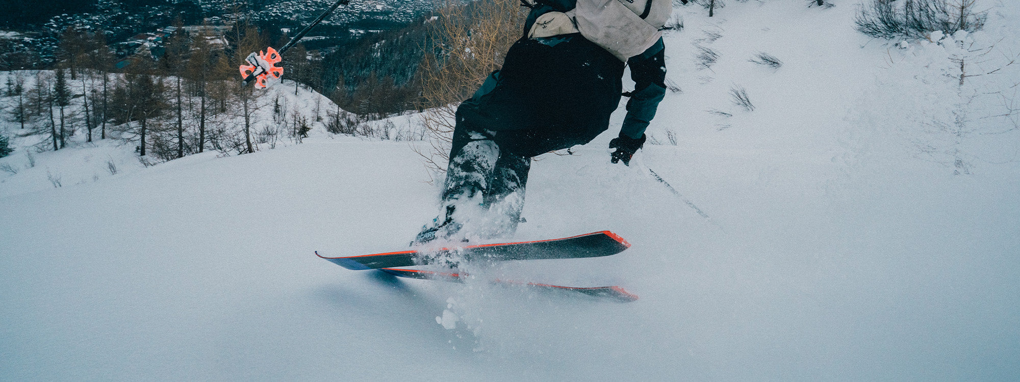 A skier wearing SCARPA 4-Quattro PRO ski mountaineering boots.