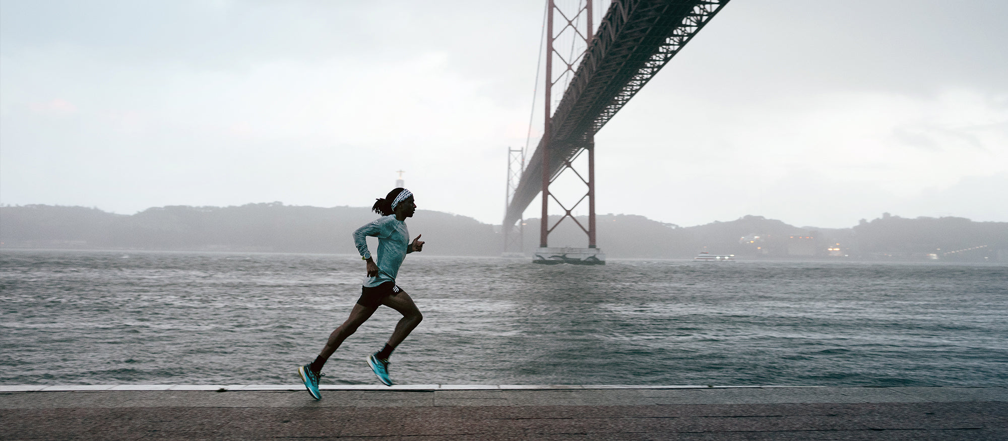 Runner on a path wearing SCARPA'S Golden Gate 2 trail running shoes