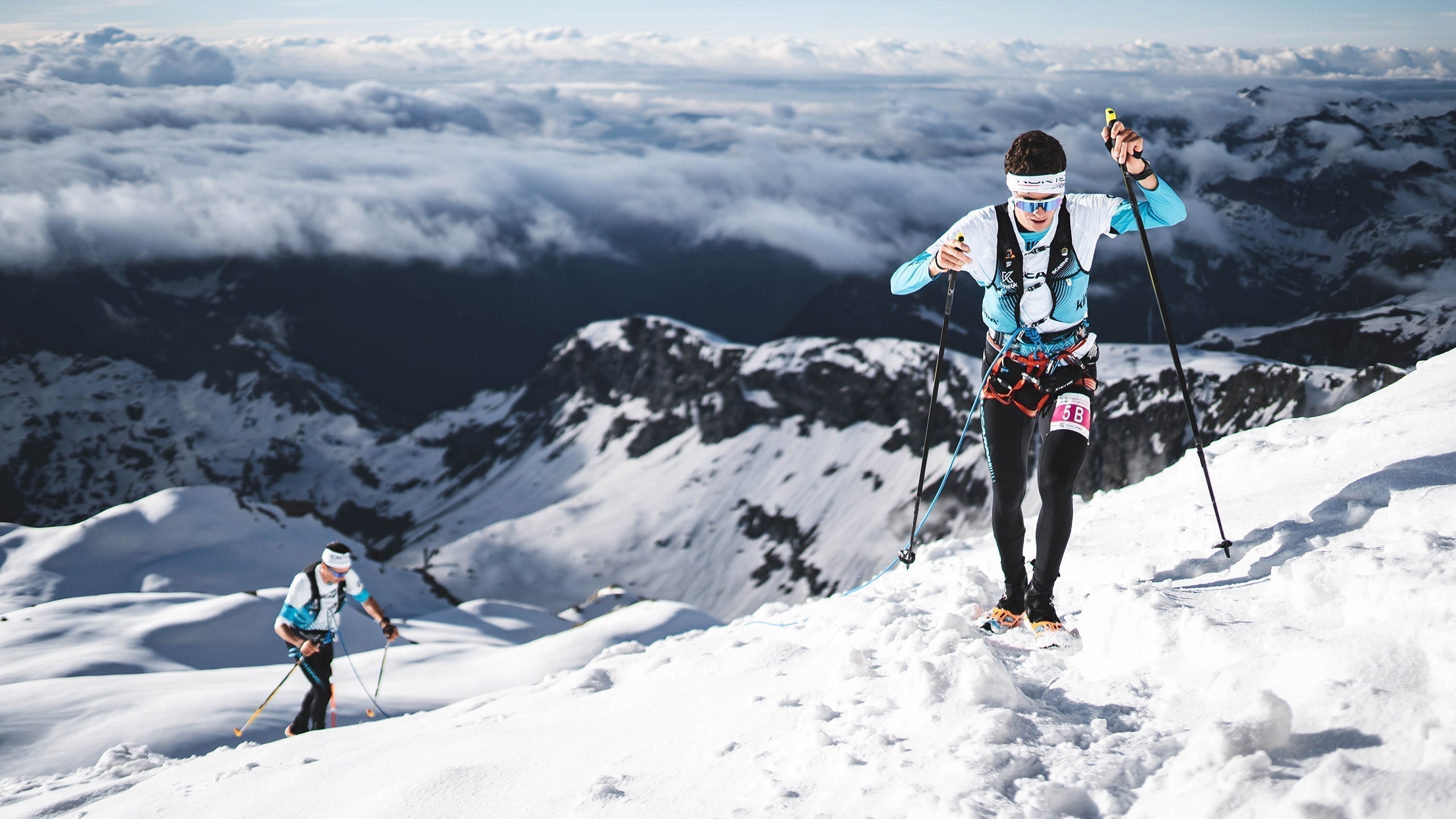 Trail runners competing at Monte Rosa Sky Marathon in the Italian Alps, wearing SCARPA trail running shoes.