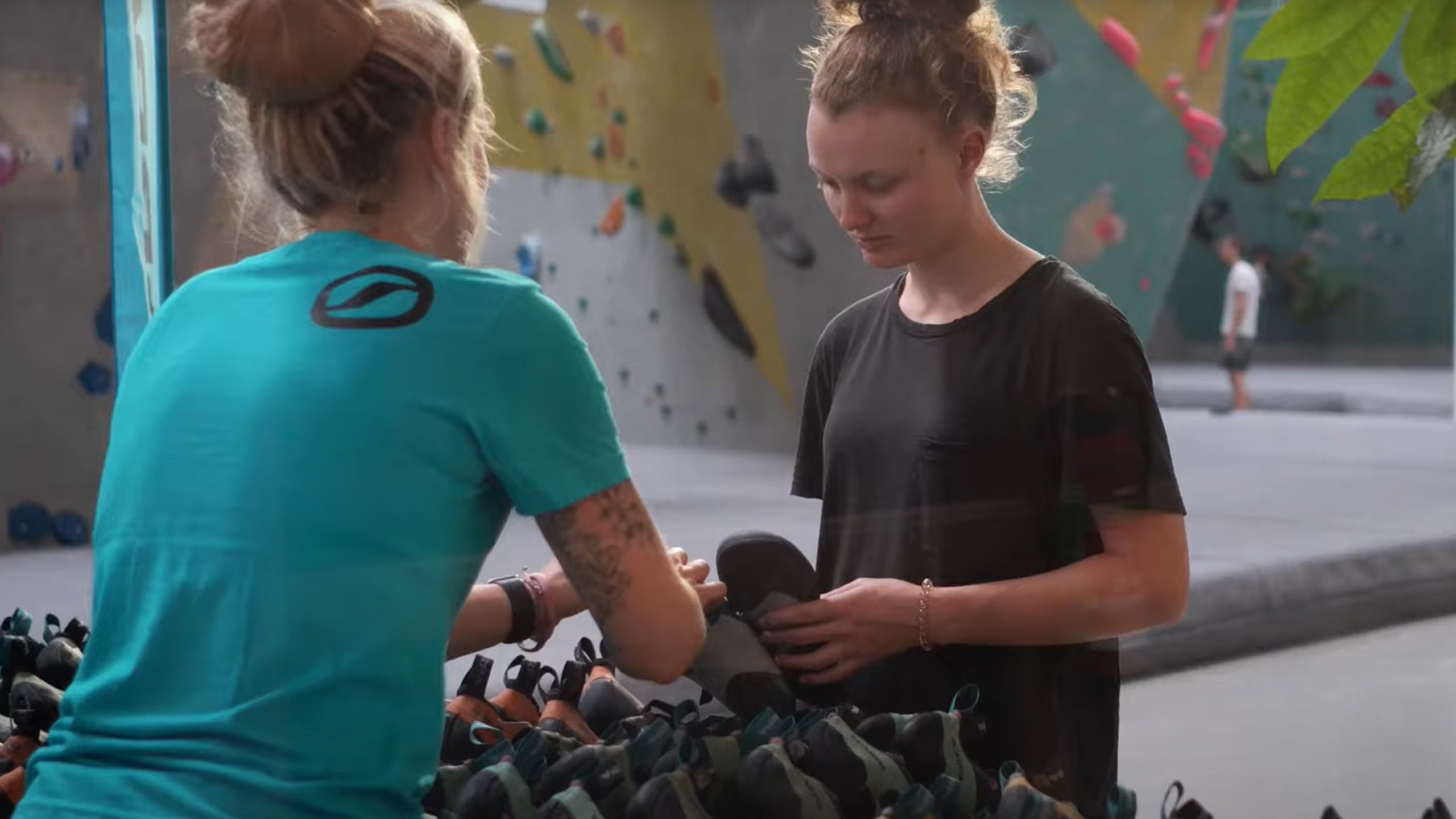 Climber checking climbing shoes during SCARPA's Climbing Demo Tour