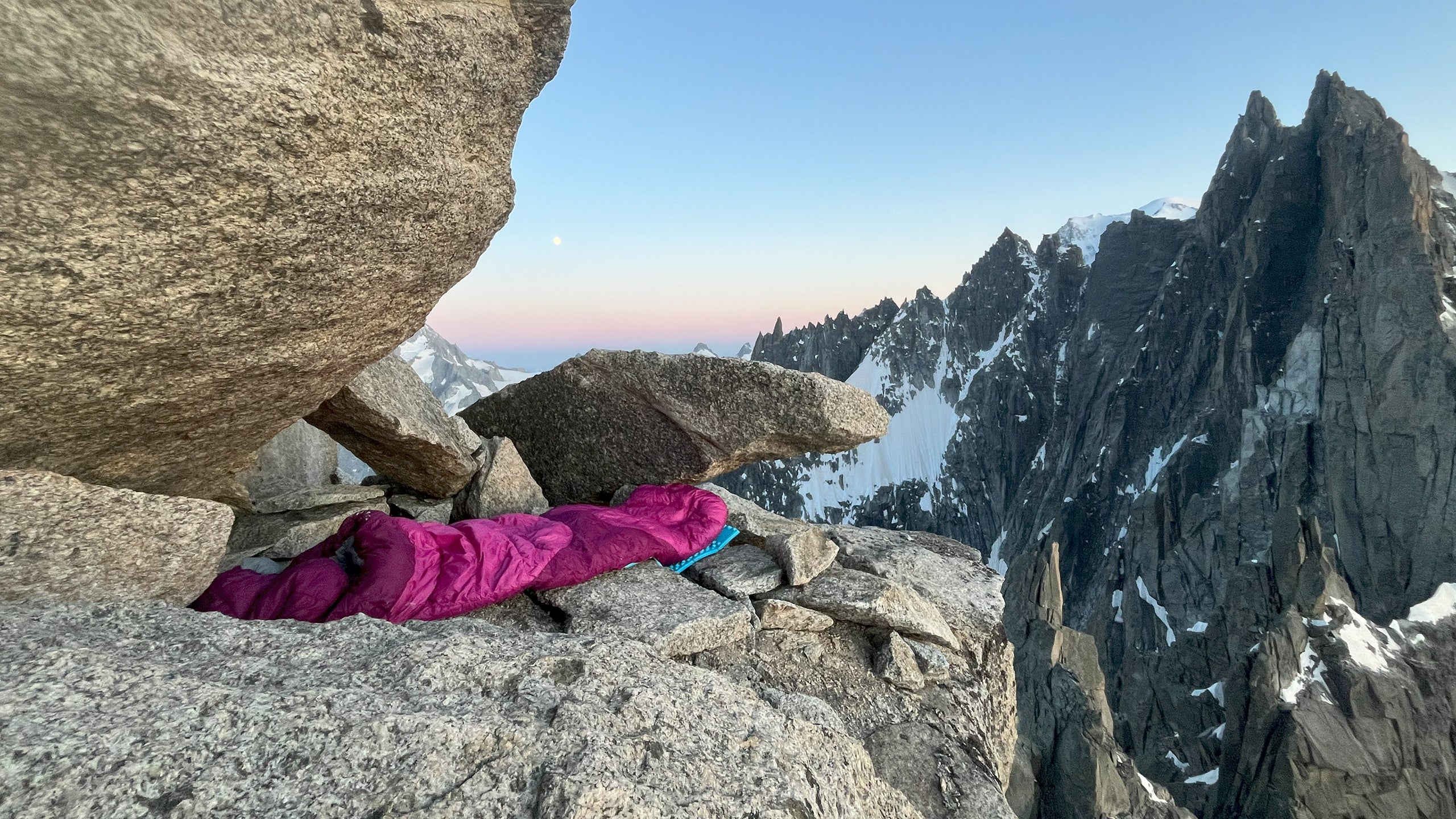 Practicing bivouacking on the Aiguilles Chamonix Traverse during summer training with SCARPA mountaineering boots.