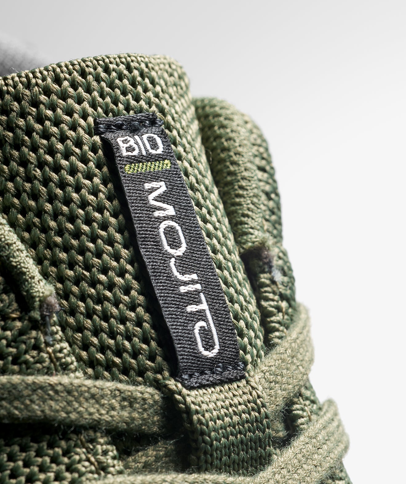 Close-up of the biodegradable label on SCARPA's Mojito BIO, that highlights its eco-friendly features
