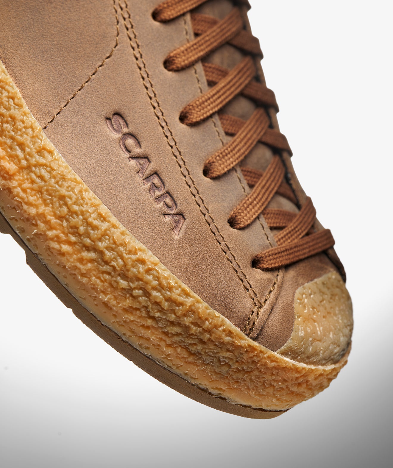Close-up of the hand-applied rand on SCARPA's Mojito Wrap PRO GTX