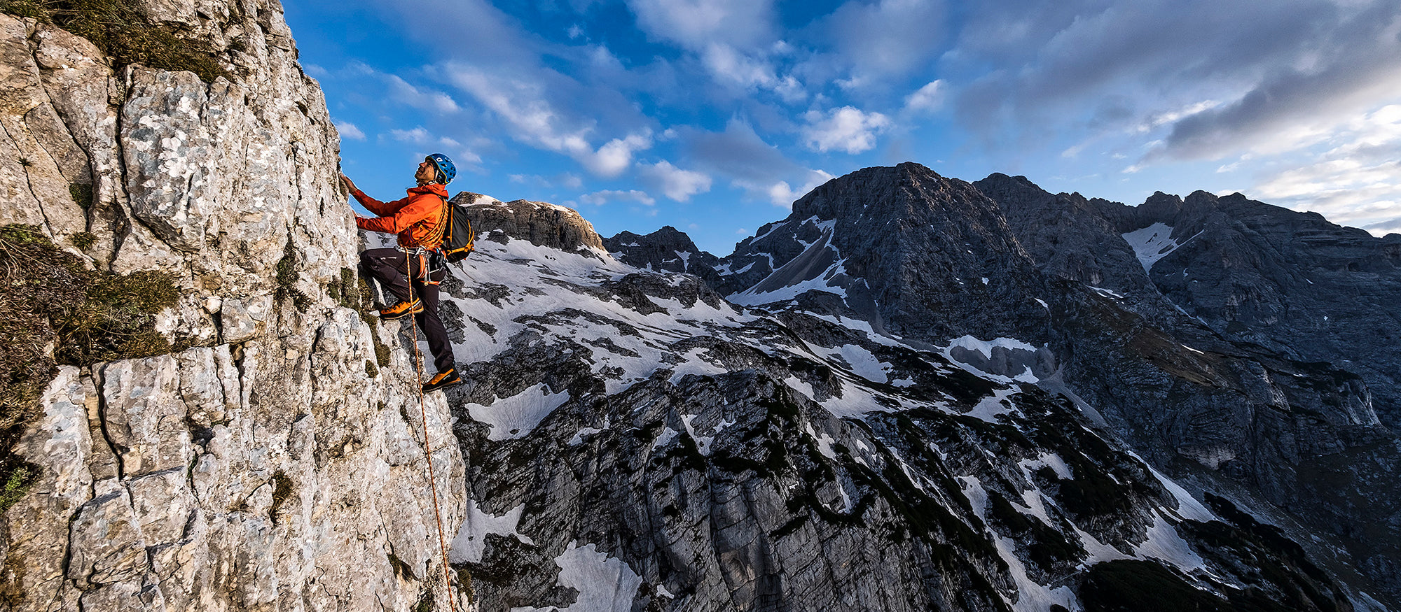Climbers on a rocky mountain face wearing Mont Blanc Pro GTX