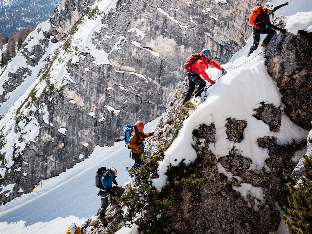 Hikers on snowy trail wearing Zodiac GTX