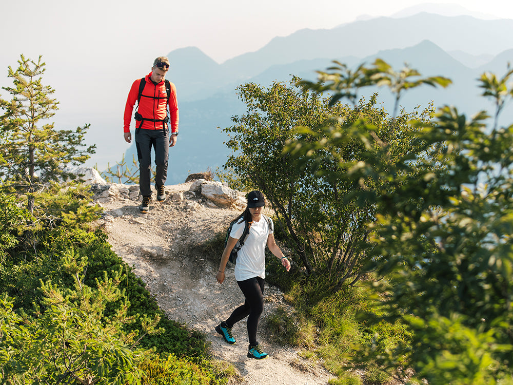 Hikers on a mountain trail wearing Rush 2 GTX