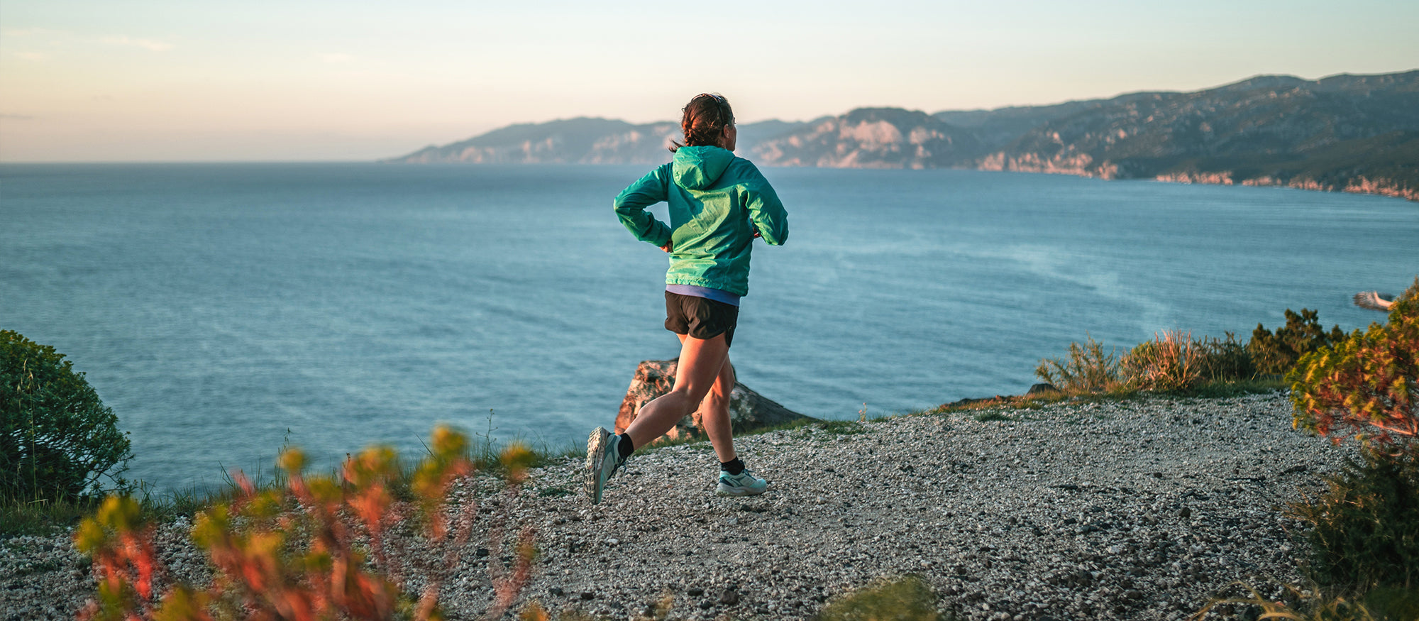 Hillary Gerardi running on a trail with Spin Planet shoes