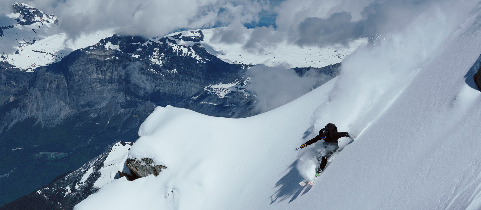 Nikolai Schirmer skiing down a steep, snow-covered mountain with 4-Quatttro Pro