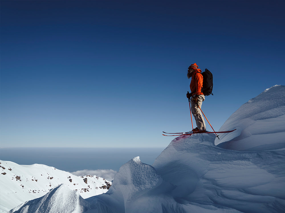 Bruno Compagnet on a swowy peak of Mount Etna wearing Maestrale