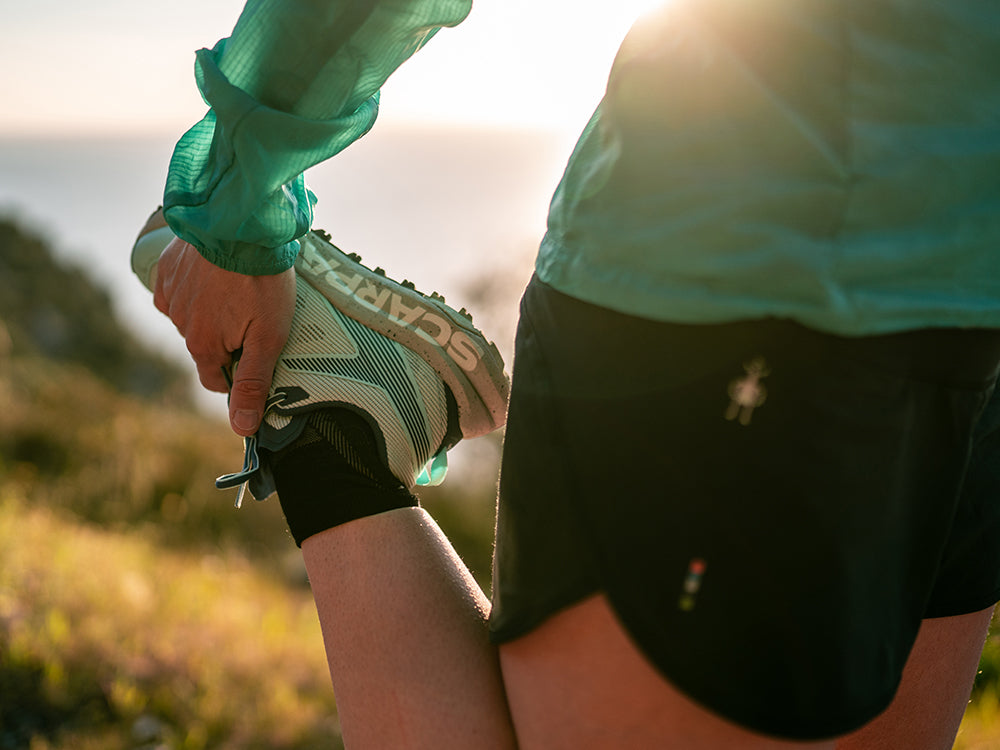 Hillary Gerardi running on a trail with Spin Planet shoes