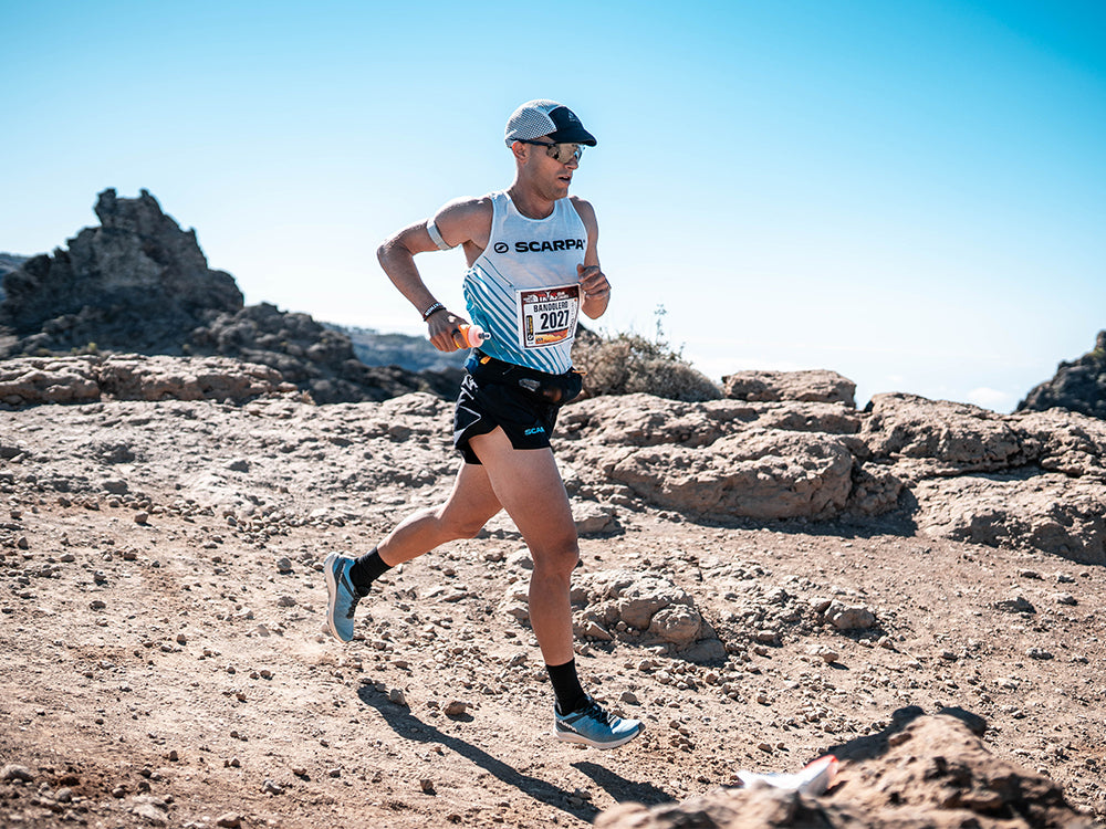 Trail runner on a mountain trail with Spin Race