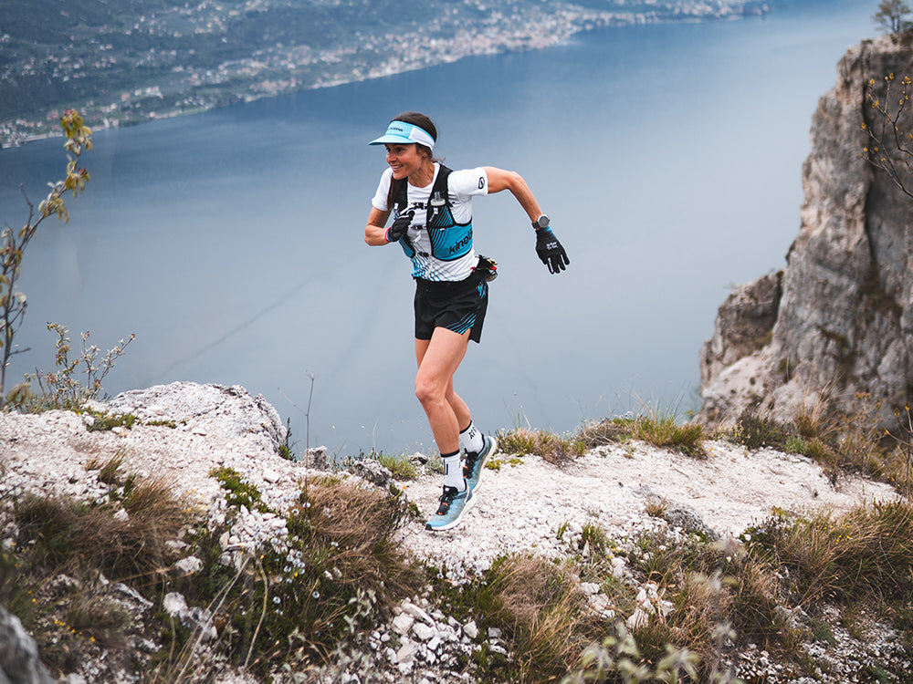 Trail runner on a mountain trail with Spin Race