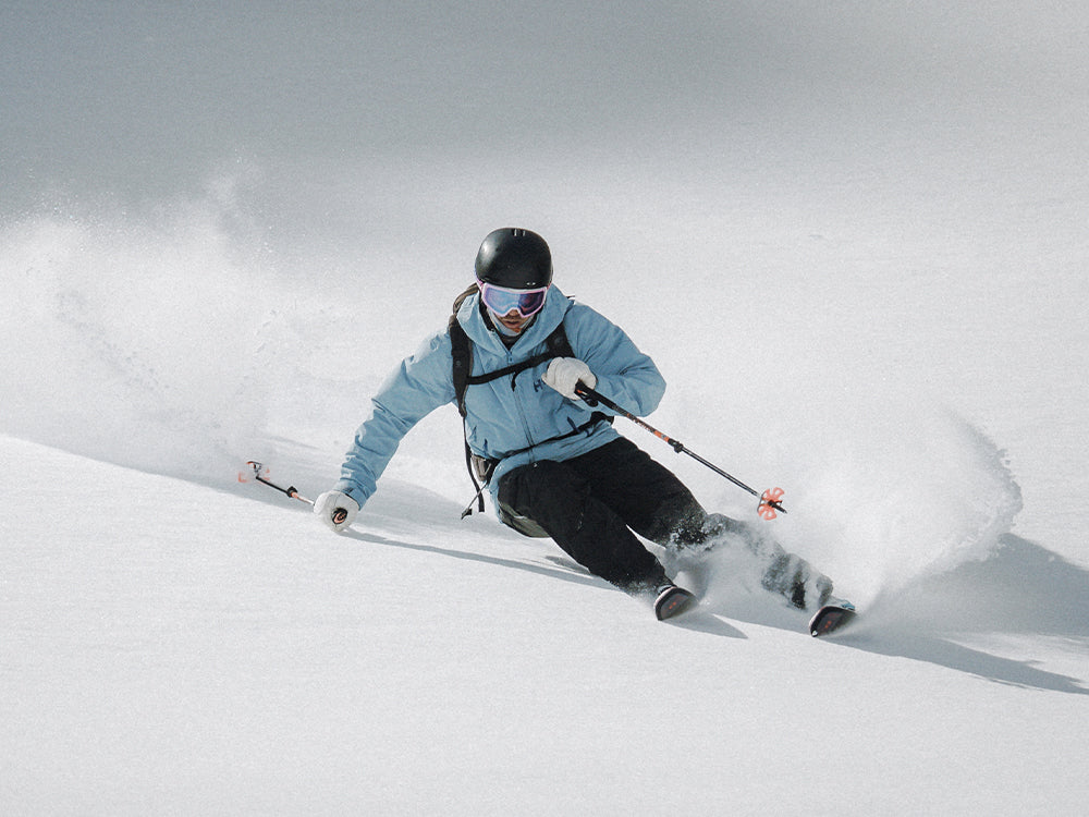 Skier wearing SCARPA 4-Quattro SL ski boots