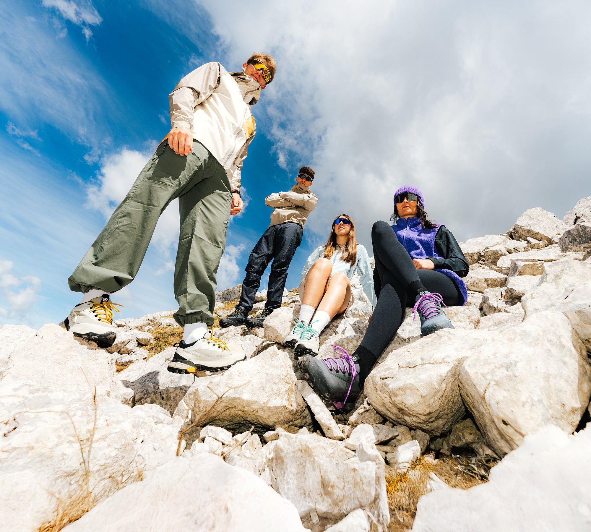 Hikers on a rocky mountain top with SCARPA's Ribelle Cross  GTX hiking shoes
