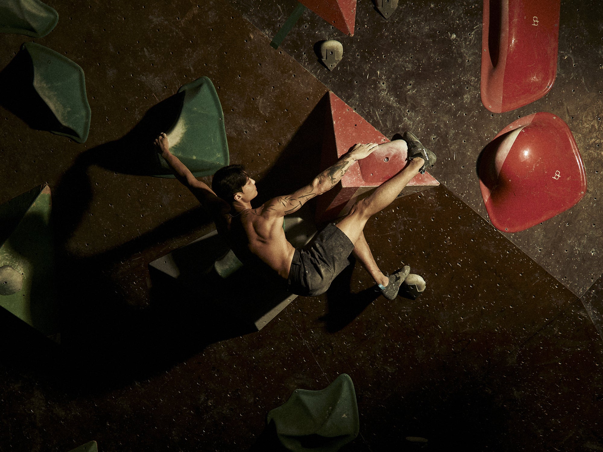 SCARPA Athlete Jongwon Chon climbing on an indoor wall with SCARPA's DRAGO XT climbing shoes