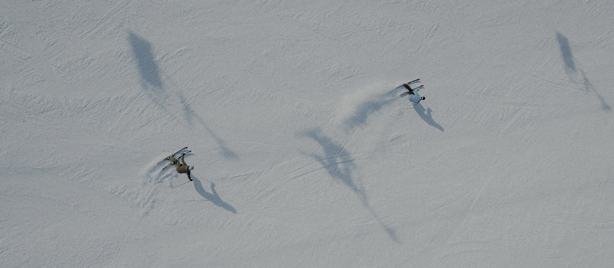 Skiers wearing SCARPA 4-Quattro SL ski boots