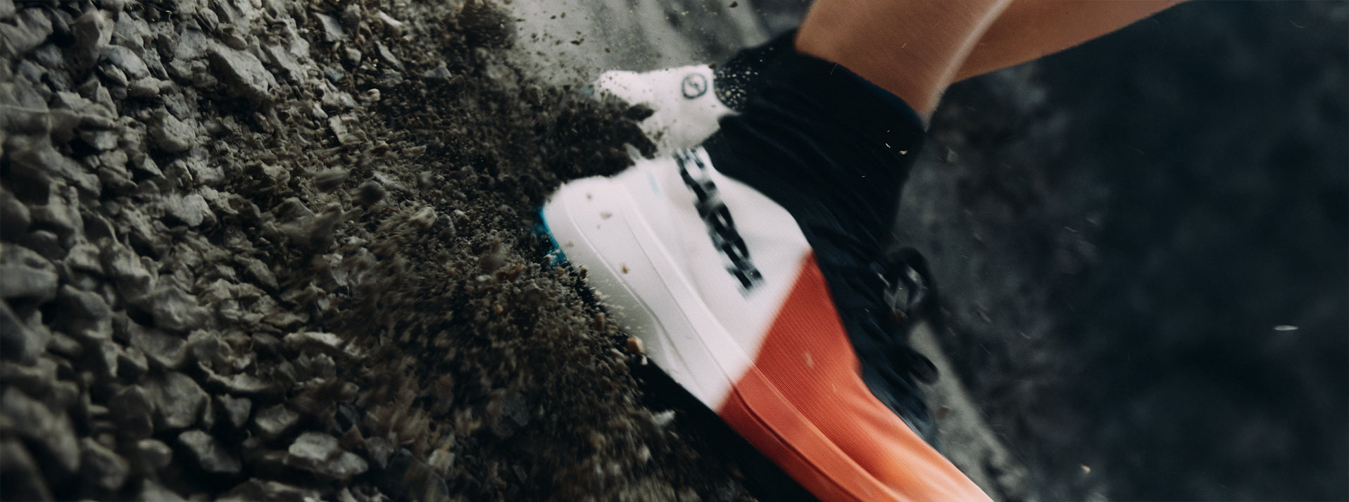 A close-up action shot of SCARPA's Alien Sky trail running shoes.